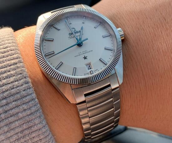 The blue hands are striking on the white dial.